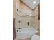 Updated bathroom with a glass-enclosed bathtub and shower, tiled walls, and modern fixtures at 6080 Kilimanjaro Dr, Evergreen, CO 80439