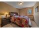 Comfortable bedroom with a cozy quilt and rustic wooden furniture at 6080 Kilimanjaro Dr, Evergreen, CO 80439