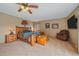 Large bedroom with a ceiling fan, ample closet space, and plenty of natural light at 6080 Kilimanjaro Dr, Evergreen, CO 80439