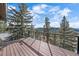This deck offers great views of the surrounding forest and mountains at 6080 Kilimanjaro Dr, Evergreen, CO 80439
