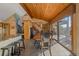 Dining room includes view, access to deck, and an adjacent breakfast bar area with seating at 6080 Kilimanjaro Dr, Evergreen, CO 80439
