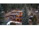 Stunning mountain home featuring multiple decks perfect for enjoying serene views and outdoor living at 6080 Kilimanjaro Dr, Evergreen, CO 80439