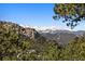 Panoramic mountain views with snow-capped peaks create a picturesque backdrop at 6080 Kilimanjaro Dr, Evergreen, CO 80439