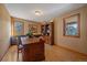 Spacious home office with a large desk and ample storage at 6080 Kilimanjaro Dr, Evergreen, CO 80439