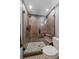 Luxurious walk-in shower with decorative tile and glass surround at 6080 Kilimanjaro Dr, Evergreen, CO 80439