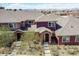 An aerial view of the house showcasing its architecture and surrounding neighborhood at 8552 Gold Peak Ln # F, Highlands Ranch, CO 80130