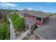 Aerial view of townhomes with well-maintained landscaping, grey roofs, and brick accents at 8552 Gold Peak Ln # F, Highlands Ranch, CO 80130