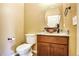 Stylish half bathroom featuring elegant vanity and toilet at 8552 Gold Peak Ln # F, Highlands Ranch, CO 80130