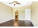 Spacious primary bedroom with ensuite bathroom and dark hardwood flooring at 8552 Gold Peak Ln # F, Highlands Ranch, CO 80130