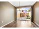 Bright dining room with hardwood floors, and sliding glass door access to the outdoor patio at 8552 Gold Peak Ln # F, Highlands Ranch, CO 80130