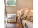View of entryway with hardwood floors, fireplace, and large windows providing natural light at 8552 Gold Peak Ln # F, Highlands Ranch, CO 80130