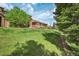 Lovely exterior of this home, landscaped yard, and cloudy blue skies above complete the picture at 8552 Gold Peak Ln # F, Highlands Ranch, CO 80130