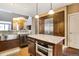Open kitchen with granite island, stainless appliances, and ample storage space at 8552 Gold Peak Ln # F, Highlands Ranch, CO 80130
