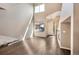 Bright living room with hardwood floors, fireplace, and large windows at 8552 Gold Peak Ln # F, Highlands Ranch, CO 80130
