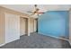 Bright main bedroom with stylish ceiling fan and accent wall at 8552 Gold Peak Ln # F, Highlands Ranch, CO 80130