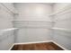 Spacious walk-in closet with white wire shelving for organized storage at 8552 Gold Peak Ln # F, Highlands Ranch, CO 80130
