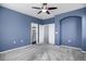 Bedroom with large closet and bathroom door, painted in calming blues at 16062 E Geddes Dr # 150, Aurora, CO 80016