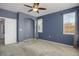 Blue bedroom with neutral carpeting, and recessed alcove at 16062 E Geddes Dr # 150, Aurora, CO 80016