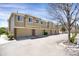 Exterior view of multiple townhomes with garages at 16062 E Geddes Dr # 150, Aurora, CO 80016