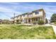 Exterior view of multiple townhomes with grass at 16062 E Geddes Dr # 150, Aurora, CO 80016