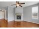 Cozy living area features a corner fireplace, hardwood floors, and a neutral color palette at 16062 E Geddes Dr # 150, Aurora, CO 80016