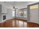 Bright living room with hardwood floors, fireplace, and ample natural light from large windows at 16062 E Geddes Dr # 150, Aurora, CO 80016