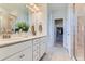 This bathroom features a glass enclosed shower and a double vanity with framed mirrors at 14133 Deertrack Ln, Parker, CO 80134