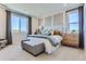 Serene bedroom featuring large windows, neutral tones, and comfortable furnishings for a peaceful retreat at 14133 Deertrack Ln, Parker, CO 80134