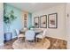 Contemporary dining room with a round table, six chairs, and stylish wall decor at 14133 Deertrack Ln, Parker, CO 80134
