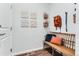 This entryway features a wood bench with colorful cushions and wall decor at 14133 Deertrack Ln, Parker, CO 80134