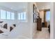 Upstairs hallway with carpeted floors, wall art and view into bedroom featuring lots of natural light at 14133 Deertrack Ln, Parker, CO 80134