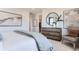 This main bedroom features neutral decor, a wood dresser, and decorative accents at 14133 Deertrack Ln, Parker, CO 80134