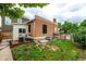 Charming backyard with a small deck, greenery, and space for outdoor enjoyment at 1803 E 36Th Ave, Denver, CO 80205