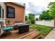 Cozy deck area in backyard perfect for relaxing, with space for seating and outdoor dining at 1803 E 36Th Ave, Denver, CO 80205