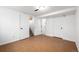 Finished basement with neutral paint, updated flooring, and access to the staircase at 1803 E 36Th Ave, Denver, CO 80205