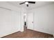 This bedroom features a ceiling fan, wood-look floors and closet at 1803 E 36Th Ave, Denver, CO 80205