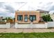 Attractive exterior view showing a well-maintained home with stylish trim and a landscaped front yard at 1803 E 36Th Ave, Denver, CO 80205