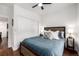 The main bedroom features wood-look floors, white walls and a closet at 1803 E 36Th Ave, Denver, CO 80205
