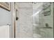 Luxurious marble tiled shower with a glass door at 1410 York St # 35, Denver, CO 80206