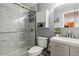 Bathroom featuring a glass shower door, vanity, and toilet at 1410 York St # 35, Denver, CO 80206