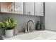 Bathroom featuring a modern faucet and a plant at 1410 York St # 35, Denver, CO 80206