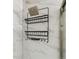Shower caddy with shelves on white marble tiled walls at 1410 York St # 35, Denver, CO 80206
