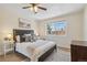 Bright bedroom featuring a ceiling fan, a large window, and neutral decor at 1410 York St # 35, Denver, CO 80206