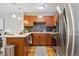 Well-equipped kitchen with wooden cabinets, stainless steel appliances, and a sleek countertop at 1410 York St # 35, Denver, CO 80206
