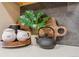 Kitchen counter with a tea kettle, sugar and creamer, and a monstera house plant at 1410 York St # 35, Denver, CO 80206