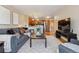Comfortable living room with open kitchen, modern appliances, and neutral tones at 1410 York St # 35, Denver, CO 80206