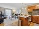 Open-concept living area with modern kitchen, natural light, and sleek furnishings at 1410 York St # 35, Denver, CO 80206