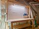 Basement work area with fluorescent lighting and peg board at 6877 Northstar Ct, Castle Rock, CO 80108