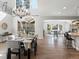 Elegant dining area with a grand chandelier and access to the living room, perfect for formal gatherings at 6877 Northstar Ct, Castle Rock, CO 80108
