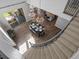 Bright and airy dining room with stylish chandeliers, wood floors, and seamless indoor-outdoor living at 6877 Northstar Ct, Castle Rock, CO 80108
